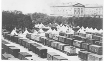 Photographie de l'Esplanade de Metz, sur laquelle se trouve des wagons de chemin de fer où été soignés les blessés de l'armée du Général Bazaine - Archives municipales de Metz Photographie de l'Esplanade de Metz, sur laquelle se trouve des wagons de chemin de fer où été soignés les blessés de l'armée du Général Bazaine - Archives municipales de Metz